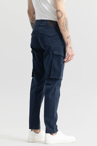 Trekyoo men's navy cargo pants with multiple pockets worn with white sneakers and white shirt